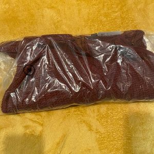 Burgundy cropped, long sleeve knit sweater.